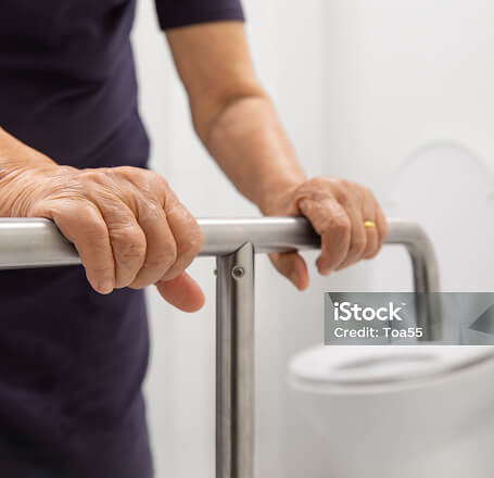 Photo of a person holding a grab rail
