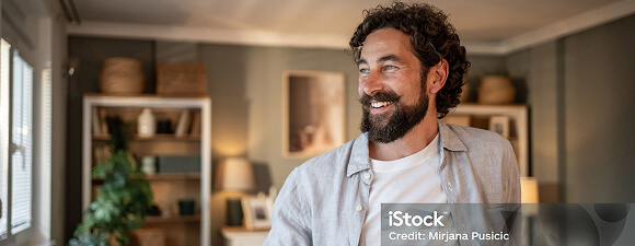 A man smiling away from camera